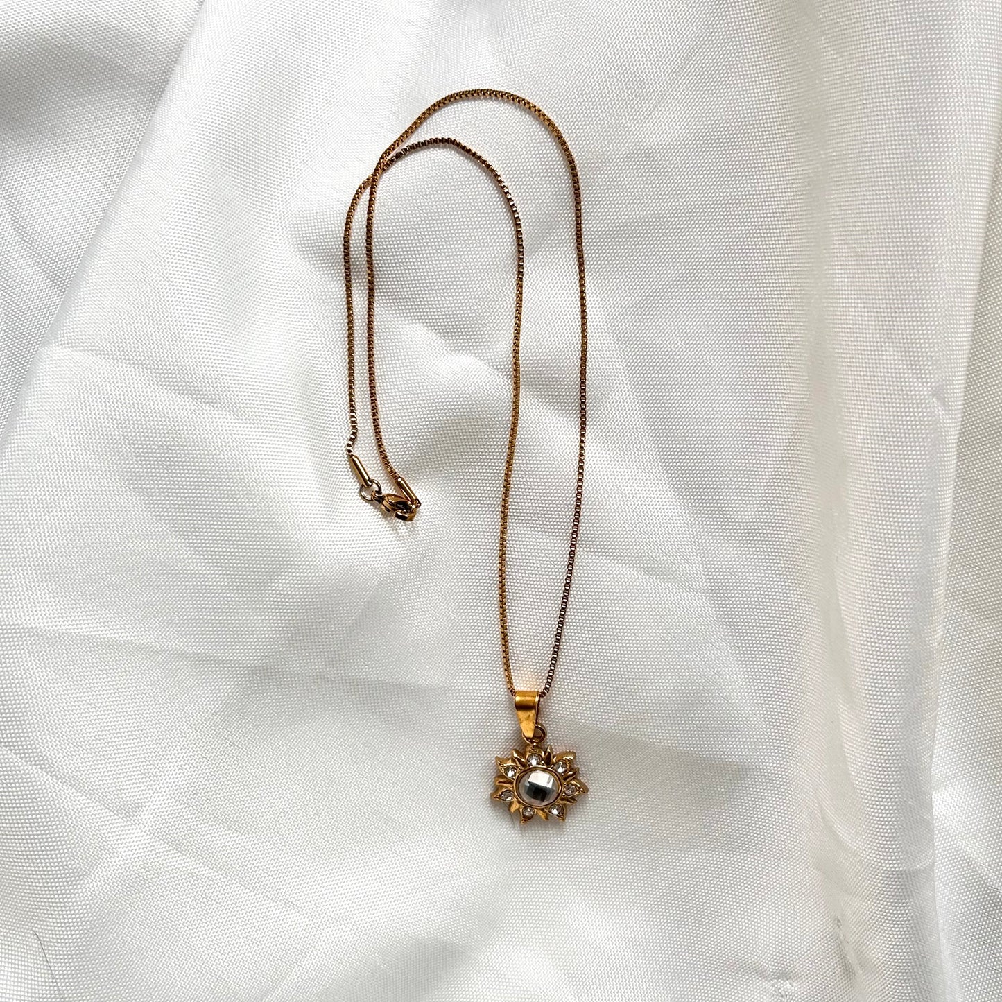 gold box chain with sun charm