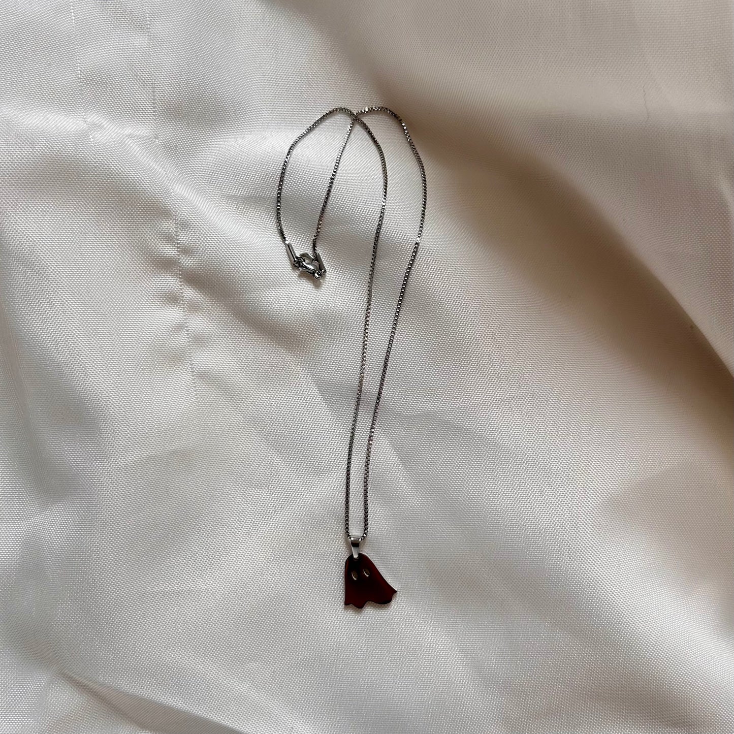 silver necklace with ghost charm