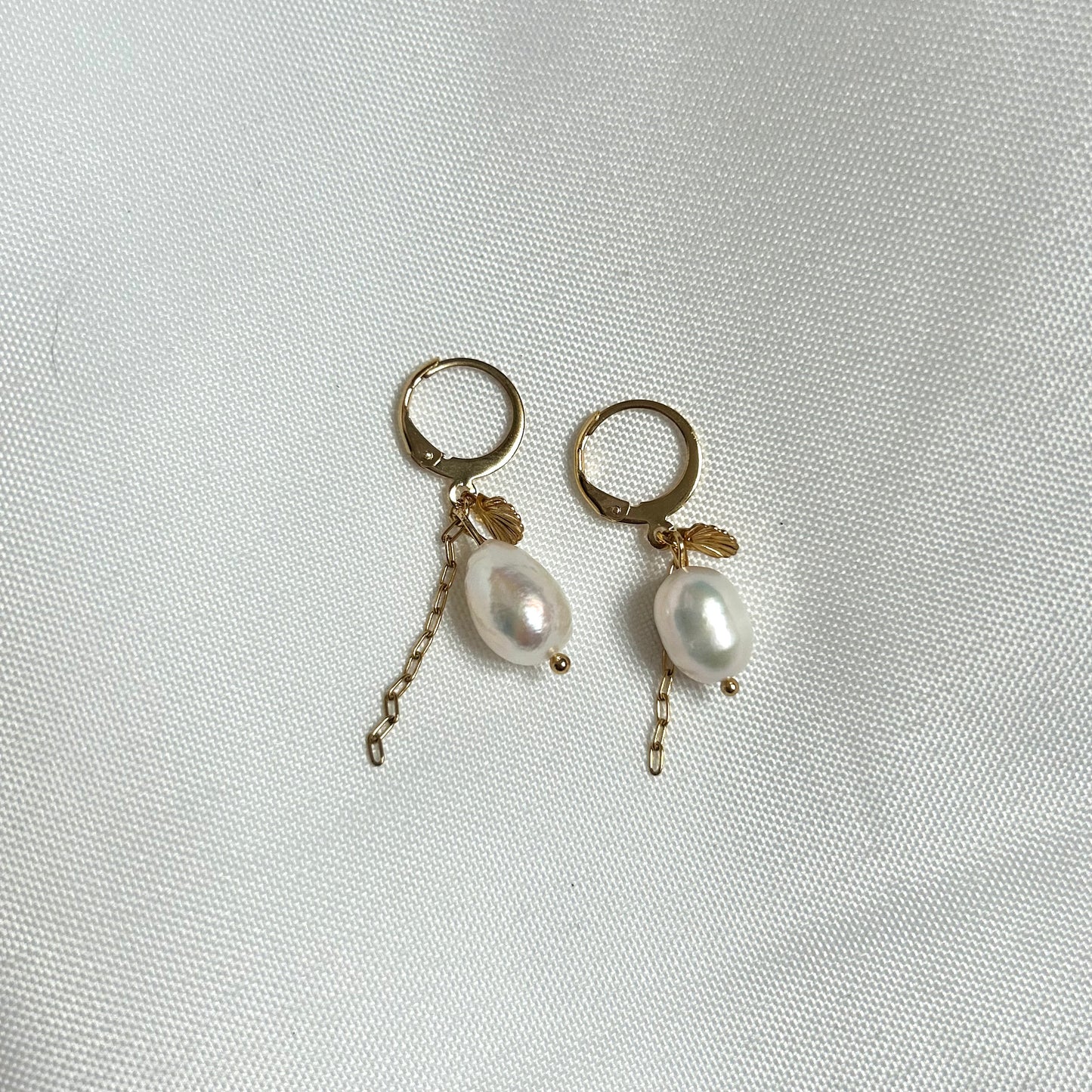 pearl earrings with shell charm