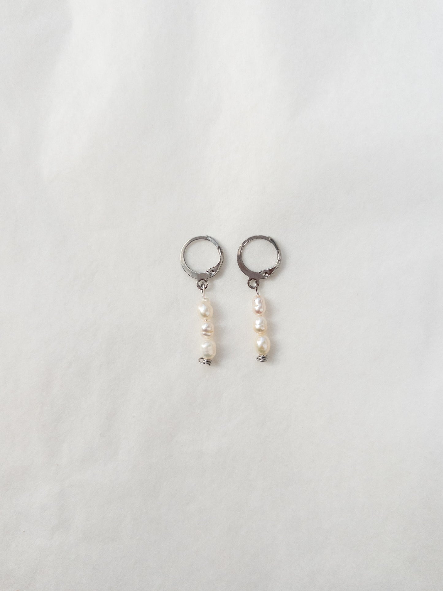 dainty pearl earrings in silver