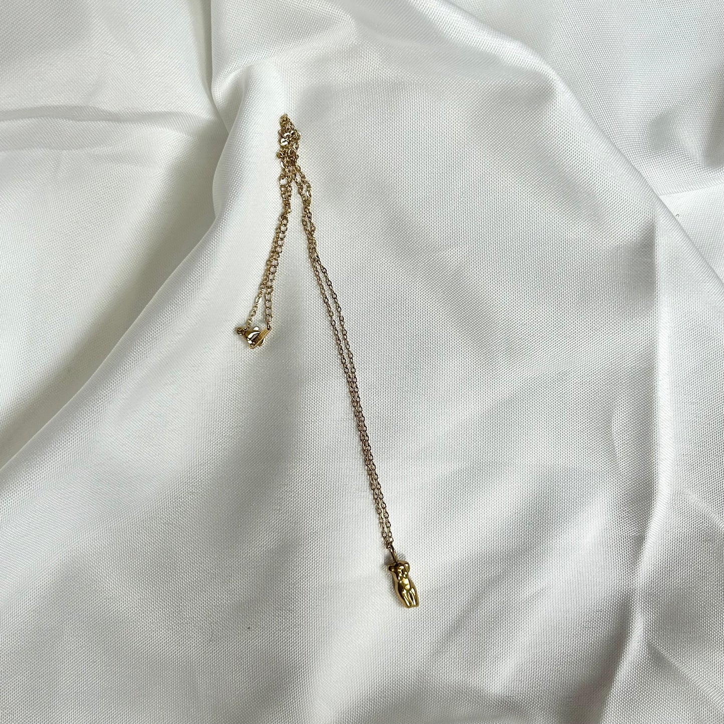 necklace with woman body charm