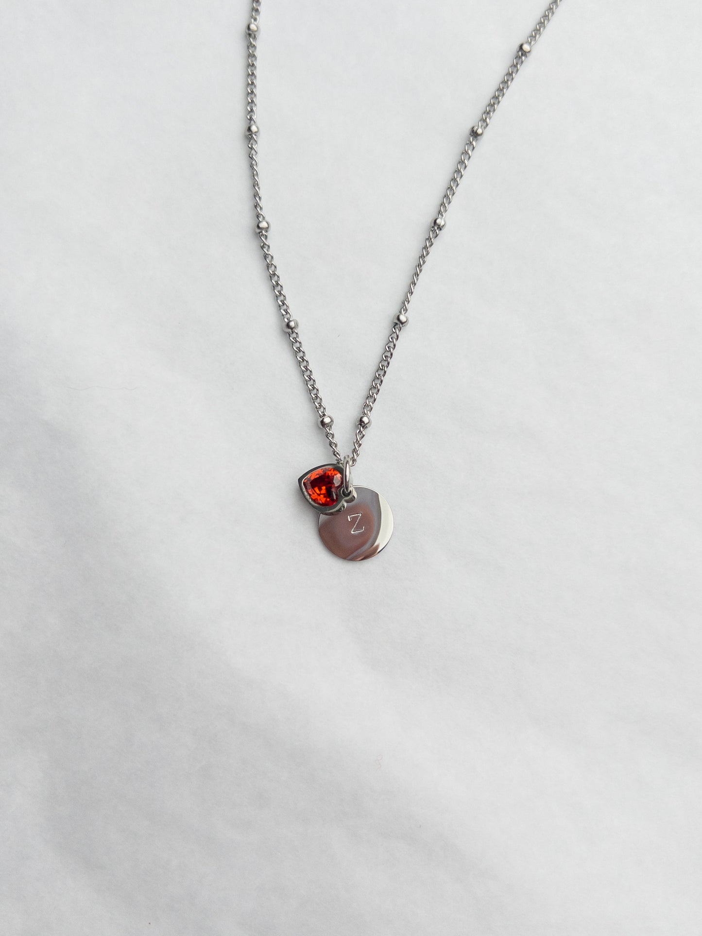 silver necklace with handstamped initial