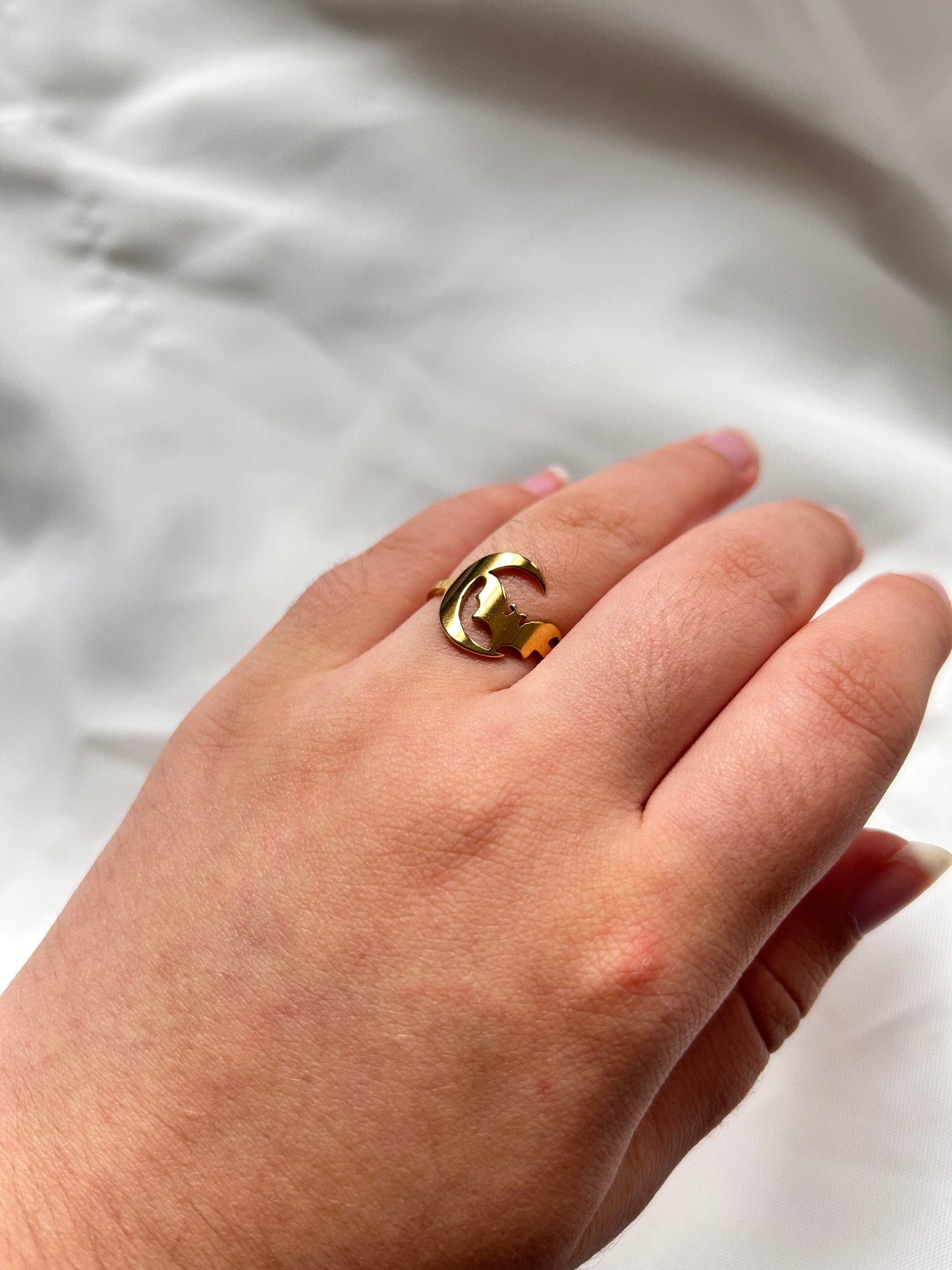 gold ring with bat and moon