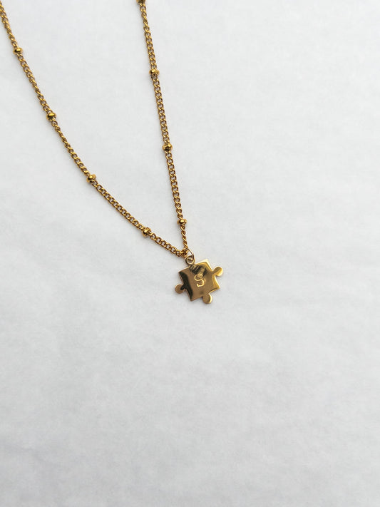 gold puzzle piece nitial necklace