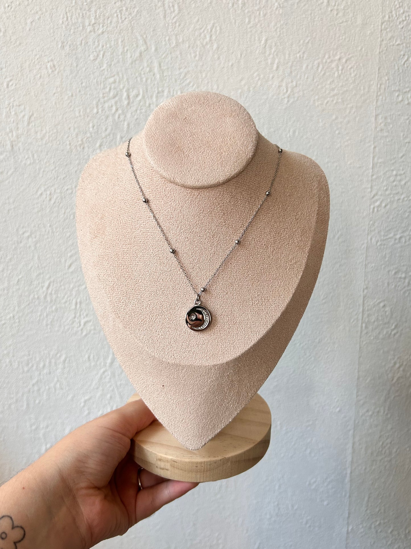 silver necklace with moon and star charm