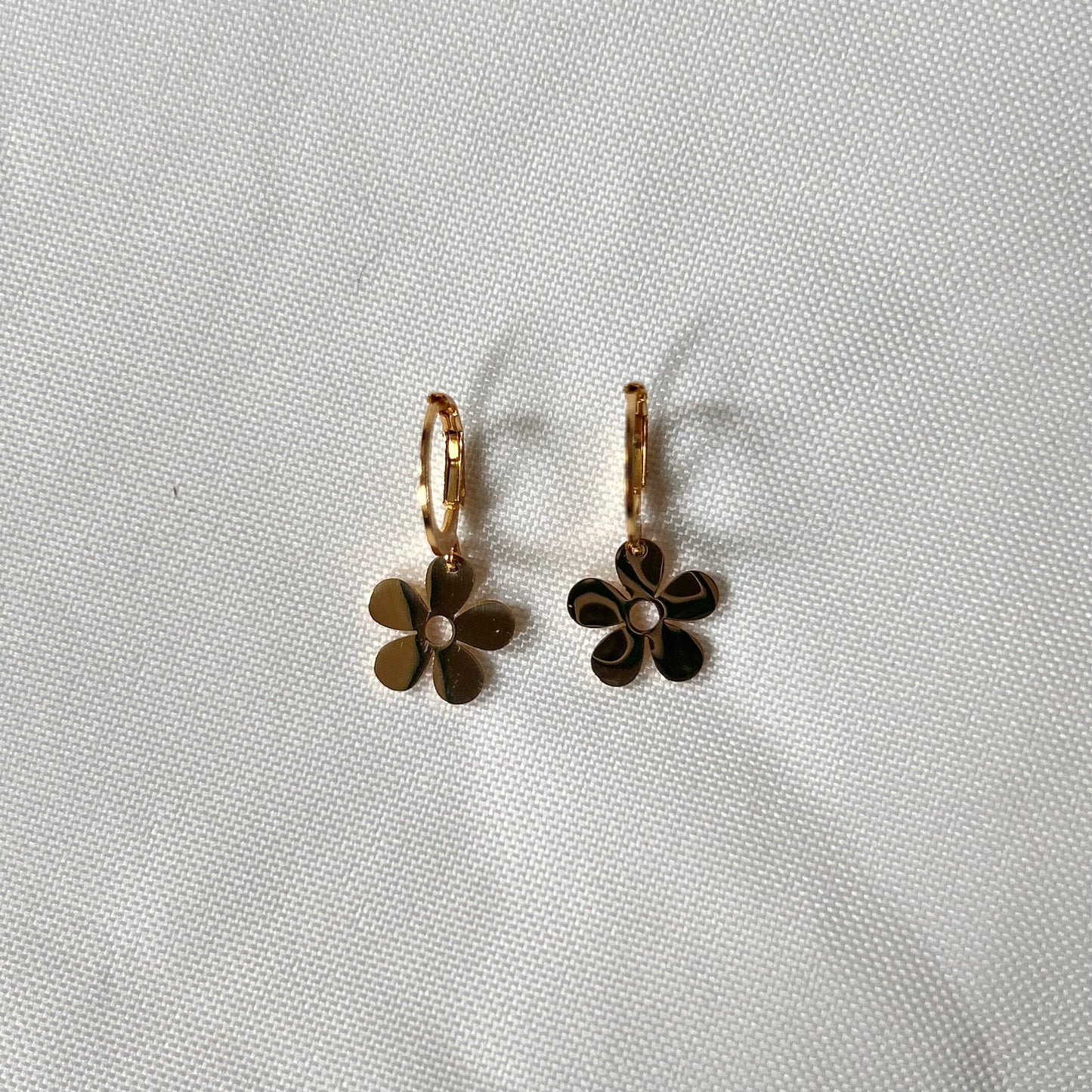 gold earrings with abstract flower