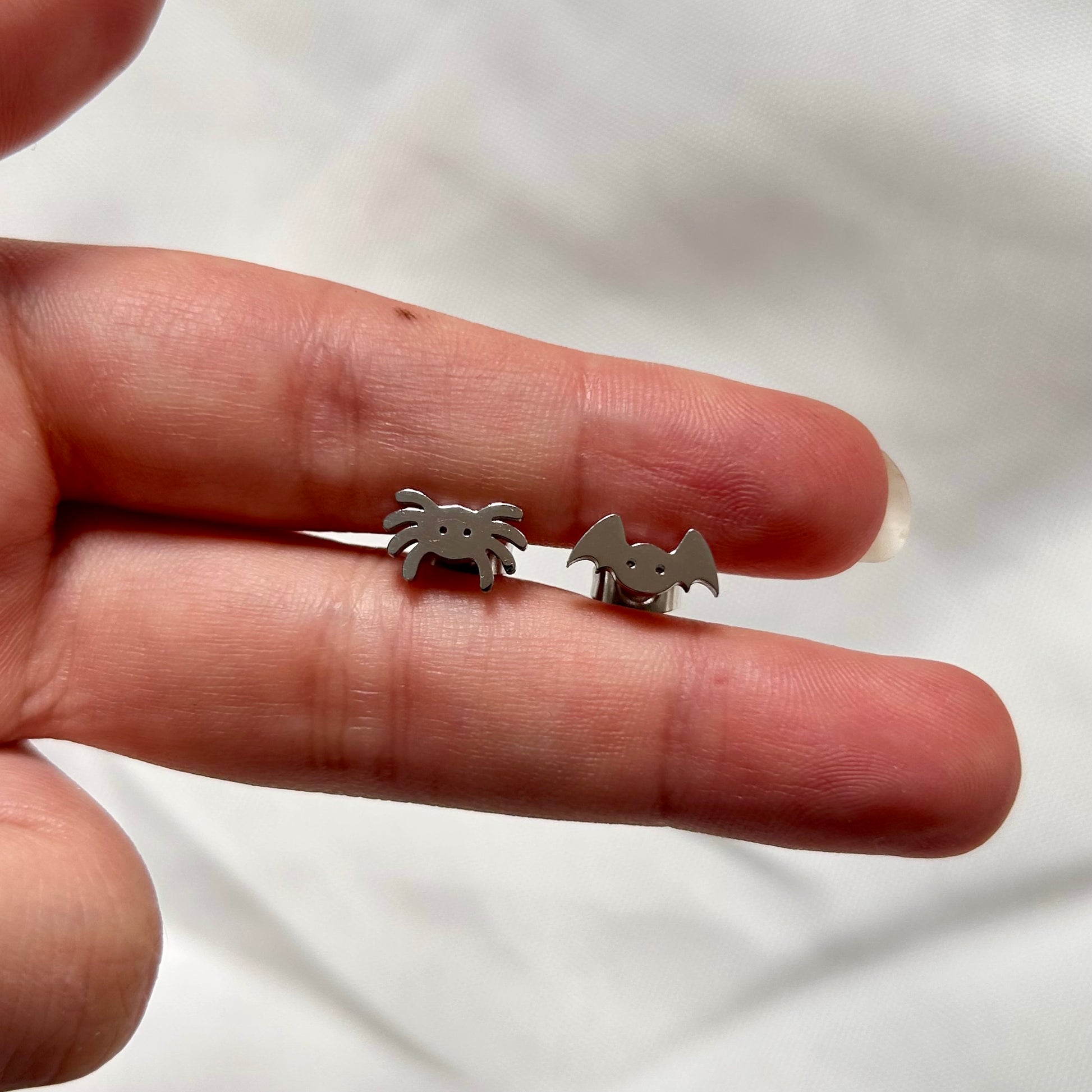 studs with spider and bat in silver