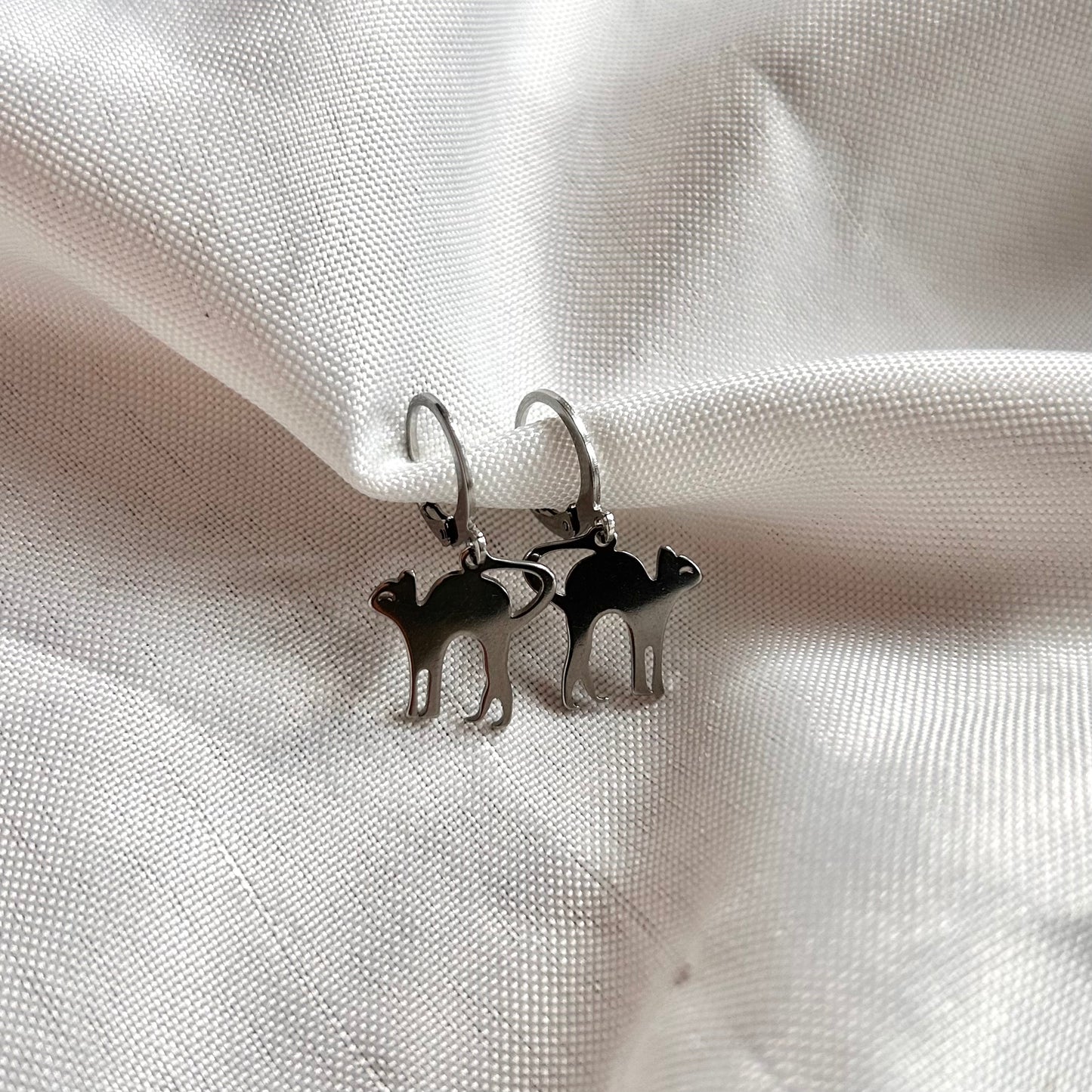 silver earrings with cats