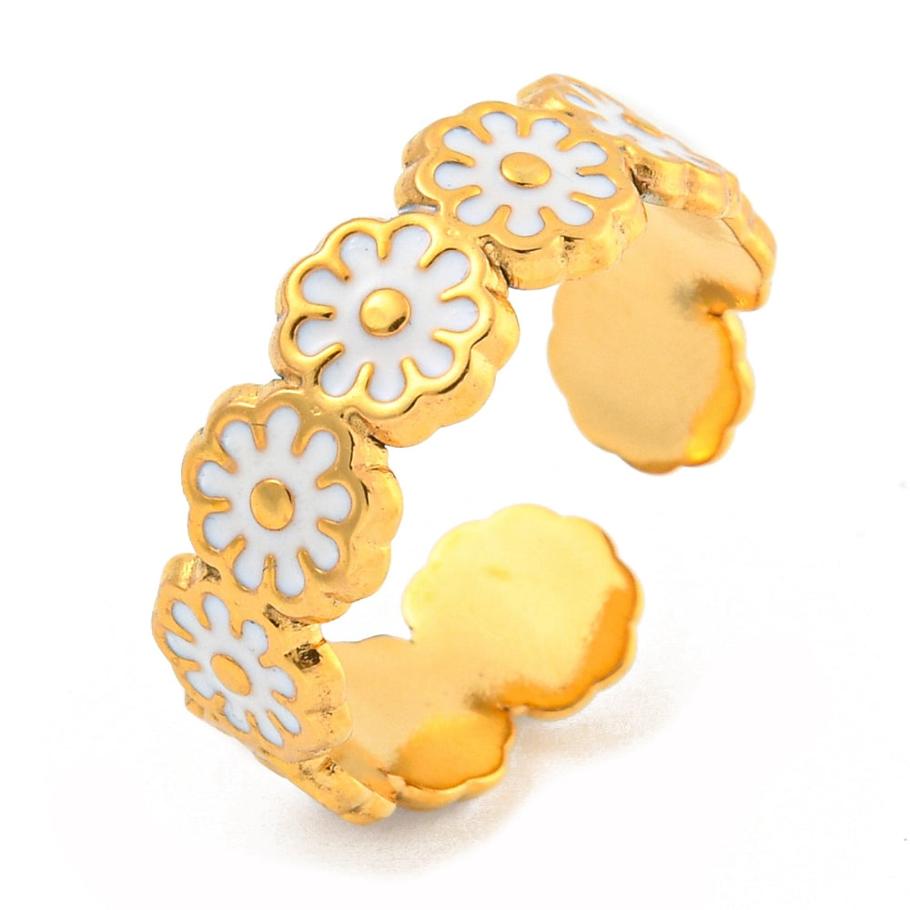 gold ring with white flowers