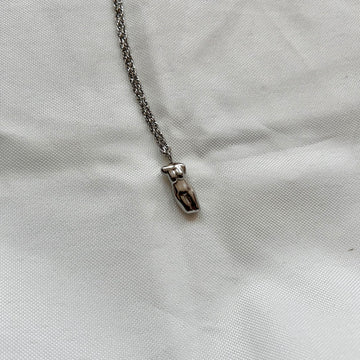 silver necklace with body charm