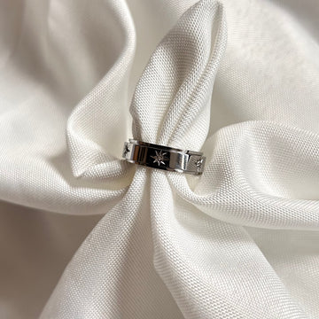 silver spinning ring with stars