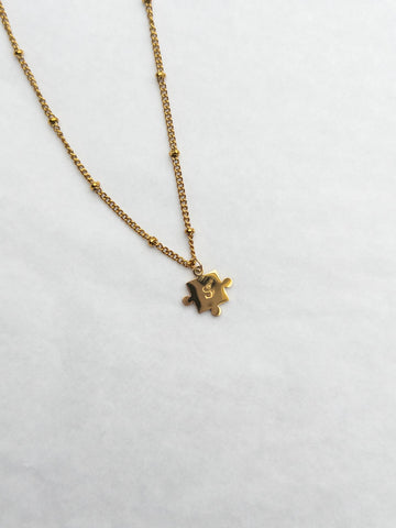gold puzzle piece nitial necklace