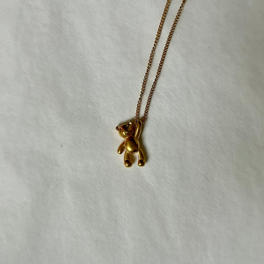 gold necklace with teddybear charm